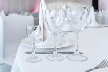 Served banquet table with empty dishes.