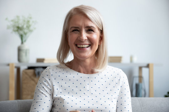 Happy Mature Old Woman Looking Talking To Camera At Home