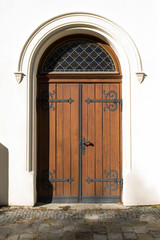 old closed wooden church door outside sunny day stop no entry