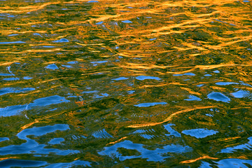 reflection on water sun down summer time