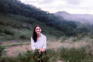 Portrait of young beautiful woman looking camera with happy and smiling,Travel at outdoor