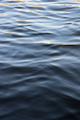 lake water with reflections in the sun