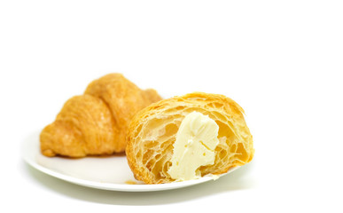 Fresh croissant in plate on white Background.Tasty buttery croissants.