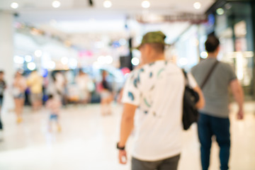 Blurred bokeh people shopping in supermarket moderntrade