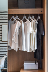modern wardrobe with set of clothes