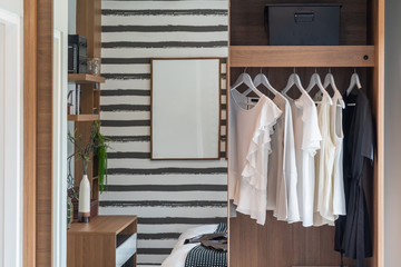 modern wardrobe with set of clothes