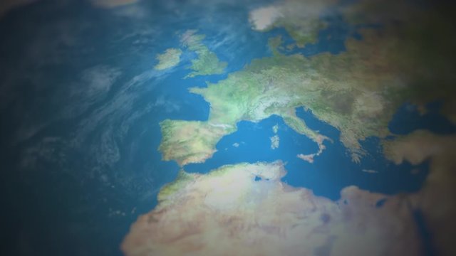 View of the world map with the camera flying over and focusing on Western Europe. Elements of this video are furnished by NASA.