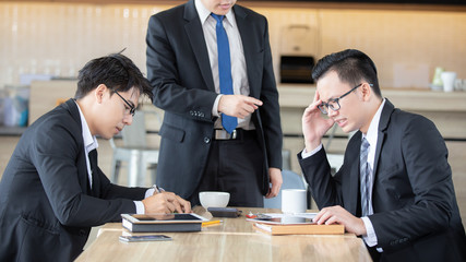 Business team during meeting conference are working documents in the coffee cafe