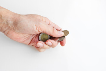 Thai coins in a female hand. Thai money trifle.