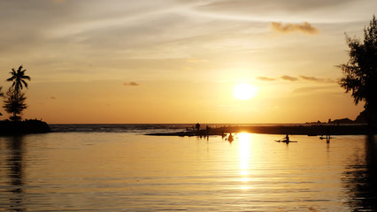 Paddle, watch the sunset on a relaxing day on one of the island's beaches.