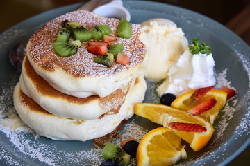 Mix fruit and pan cake sandwich with Icecream and whip cream.