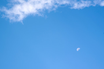 clouds, blue sky and Crescent moon in the morning