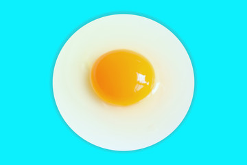 Organic round  (White eggs and  yolk )of chicken Cooked high protein good for health decorative isolated on pastel light blue  background texture close-up