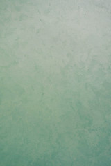 green decorative plaster texture with pearl glow