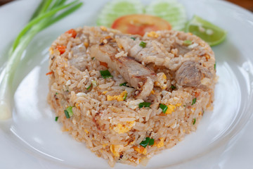 Closeup Fried rice with pork in white plate.