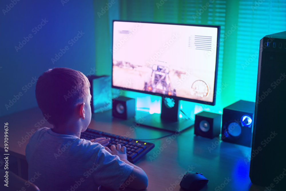 Aufkleber boy is playing on the computer. gaming industry growth concept and the problem with the mental devel