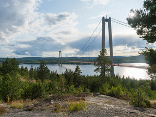 Summer view of the High coast bridge Hogakustenbron seen from the north bank of the river Angermanalven located near Harnosand in Vaesternorrland, Sweden.