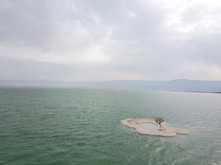 Aerial Image of small island that was created from Salt in the heart of the Dead Sea.