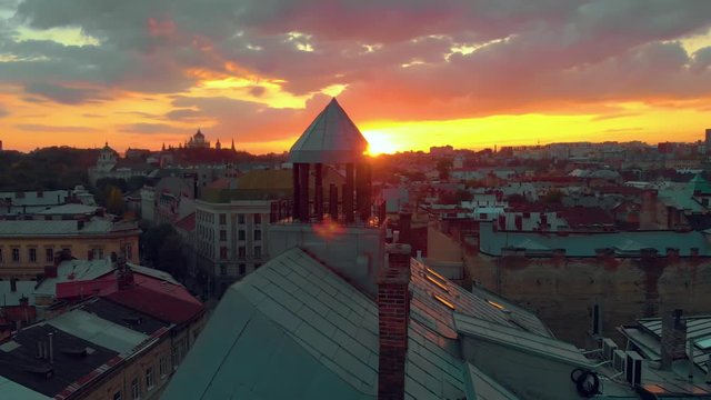 Sunset on roofs column chimney