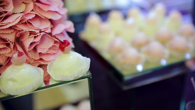 sweet table. white chocolate. mousse. sweet snacks with white chokolate hearts. serving