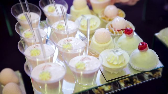 sweet table. white chocolate. mousse. sweet snacks with white chokolate hearts. serving