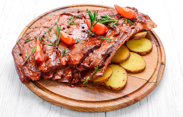 Close up Mouth Watering Juicy Grilled Pork Rib Meat on Top of Wooden Cutting Board