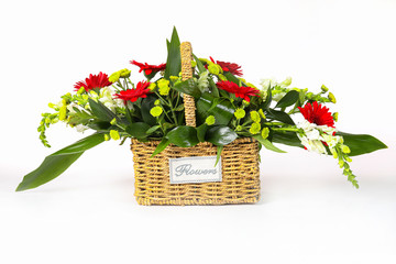 Flowers in a basket isolated on white