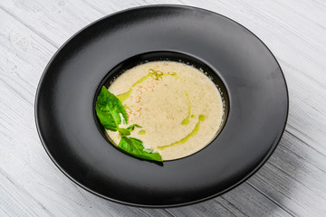 mushroom cream soup on white wooden board