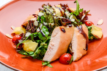 Spring salad. Wooden table background.