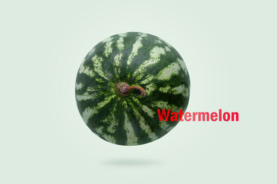 Levitating watermelon with red "Watermelon" inscription on light green background