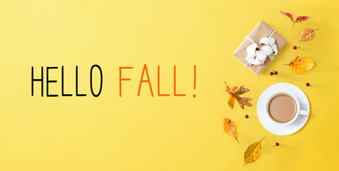 Hello fall message with autumn theme with coffee and gift box