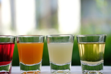 cocktail shot glass on bar counter