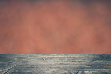 Holzplatte mit Hintergrund Orange Bokeh und Textfreiraum	