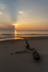 Beautiful cloudscape against sand beach in sun rise time