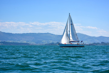Fototapeta premium boats and sailboats off the coast