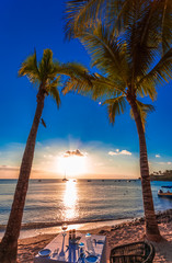 Prepared table at sunset on the beach of Mauritius 