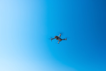 Drone is flying, drone is waiting for flight, sky is clean blue