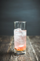 Sweet cocktail with figs liqueur and thyme. Selective focus. Shallow depth of field.