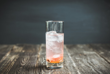 Sweet cocktail with figs liqueur and thyme. Selective focus. Shallow depth of field.