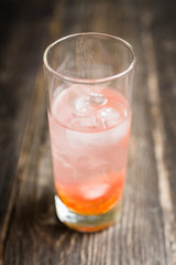 Sweet cocktail with figs liqueur and thyme. Selective focus. Shallow depth of field.