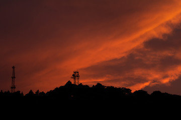 Fiery Sunset Sky over a forest.