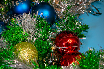 Colorful beautiful Christmas balls in shiny tinsel create an unforgettable holiday feeling.