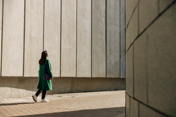 Young female person looking forward at light