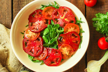 healthy salad tomatoes (vegetables, onions, greens, lettuce, sunflowers, microgreens and more) menu concept. food background. copy space. Top view