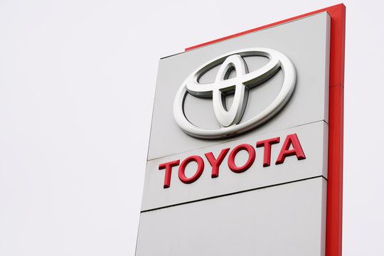toyota car dealership sign logo store sales of hybrid electric vehicles shop