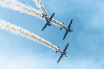 Aerobatics performed by three aircraft