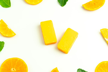 Orange facial soaps in middle of orange piece frame