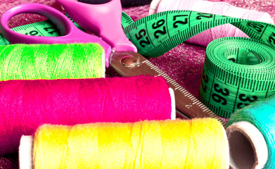 Sewing accessories. Thread , scissors, buttons, and tape measure seamstress.