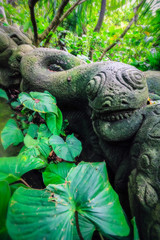 Balinese stone snake statue in monkey forest Ubud