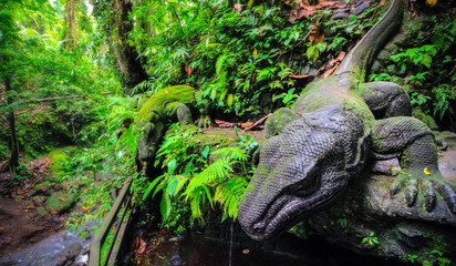 ancient komodo dragon statue in monkey forest Ubud Bali